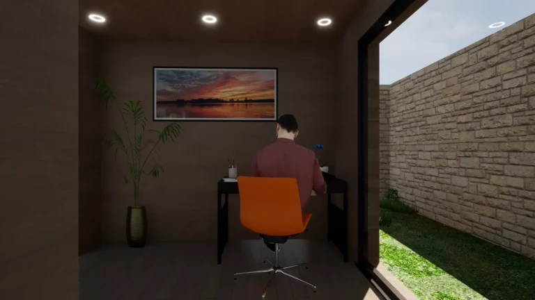Personne travaillant à son bureau dans un module de jardin en bois