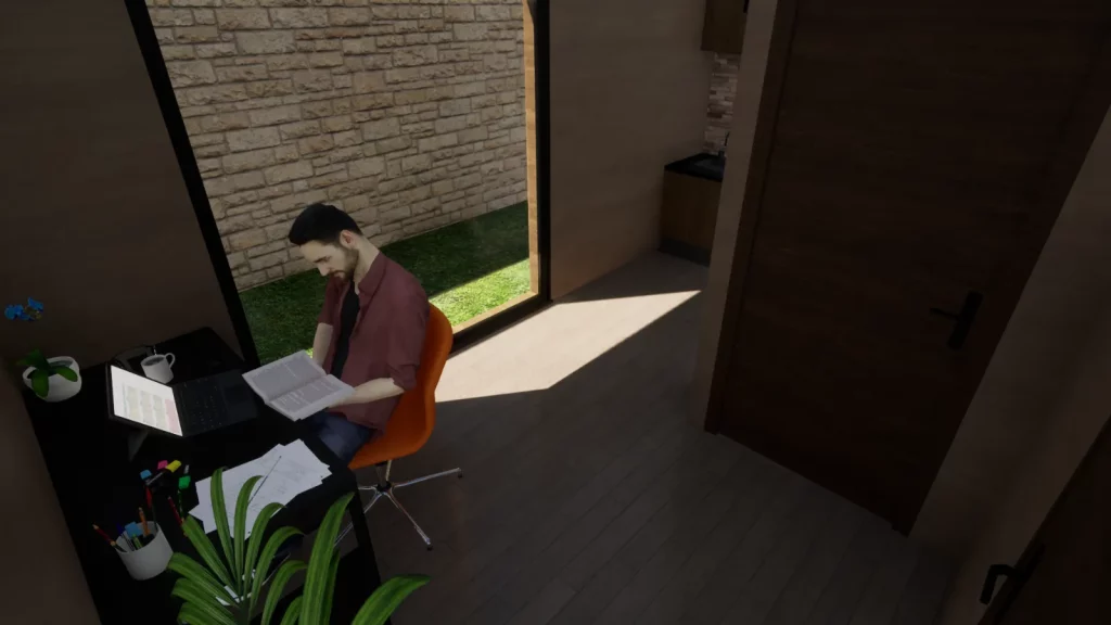 Personne en télétravail à son bureau, dans un module de jardin en bois